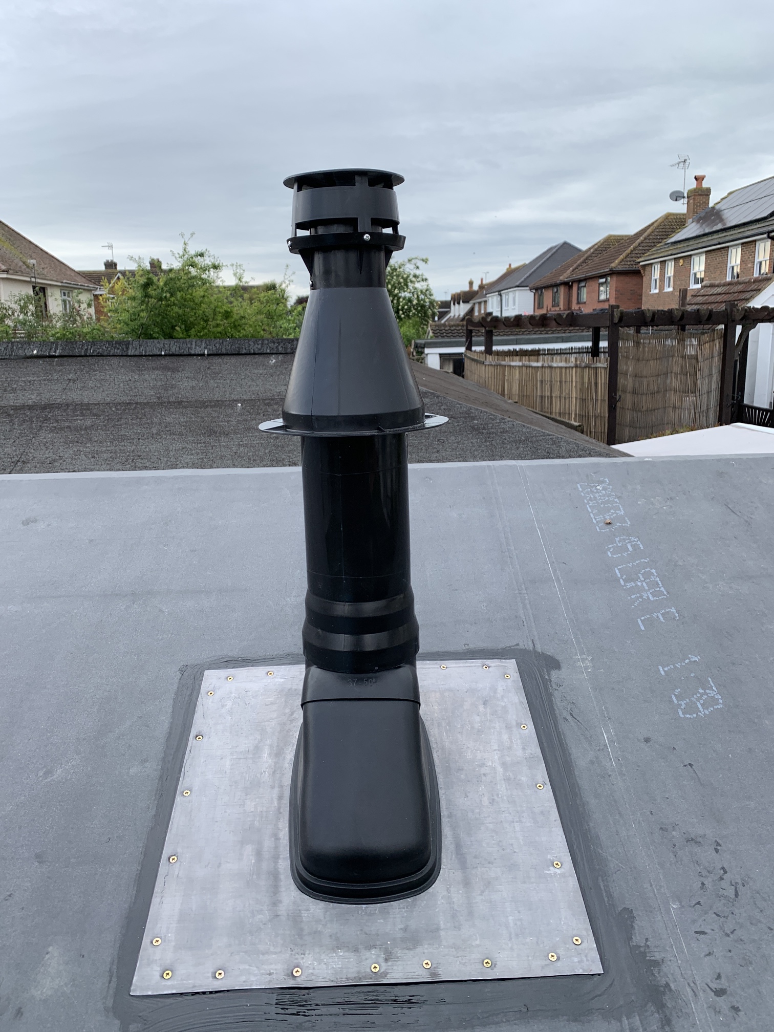 Flue well supported and shed roof sealed. Protecting the new swimming pool boiler.